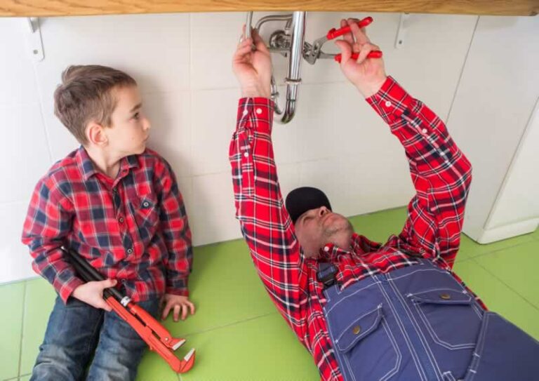 man and son DIY plumbing