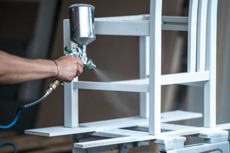 spray painting a chair