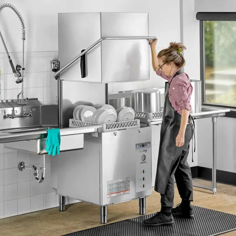 woman opening commercial dishwasher