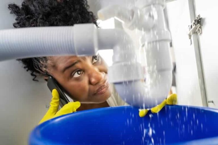 woman calling a plumber