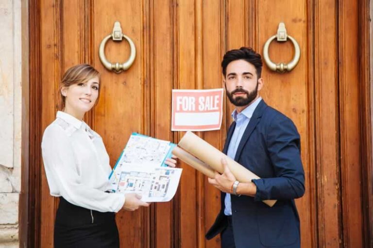 real estate agents in front of the house