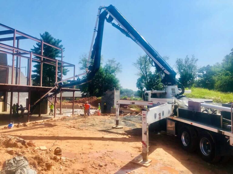 concrete pump truck pumping concrete