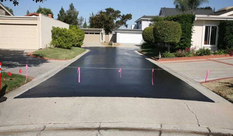 newly sealcoated asphalt driveway