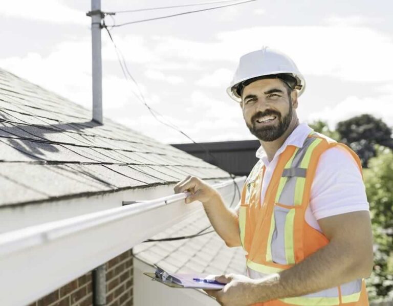 roofing contractor inspecting the roof