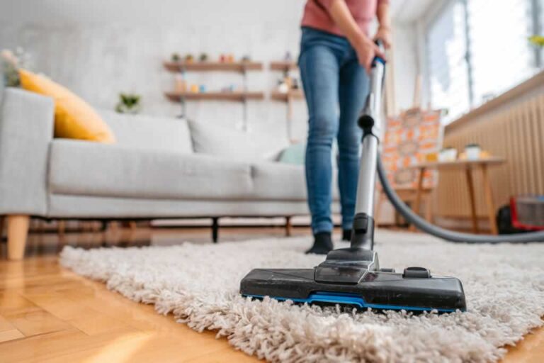 vacuuming the carpet