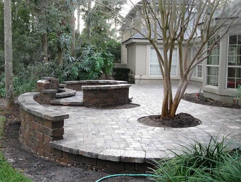 round concrete patio with tree in the middle