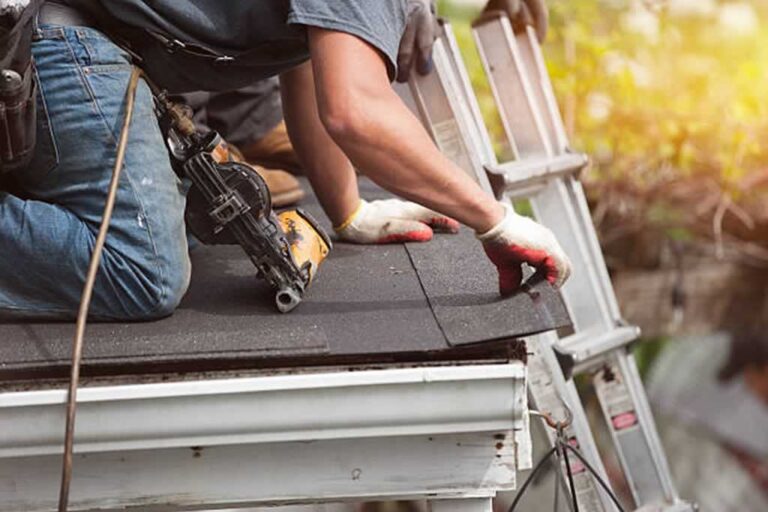 man repairing the roof
