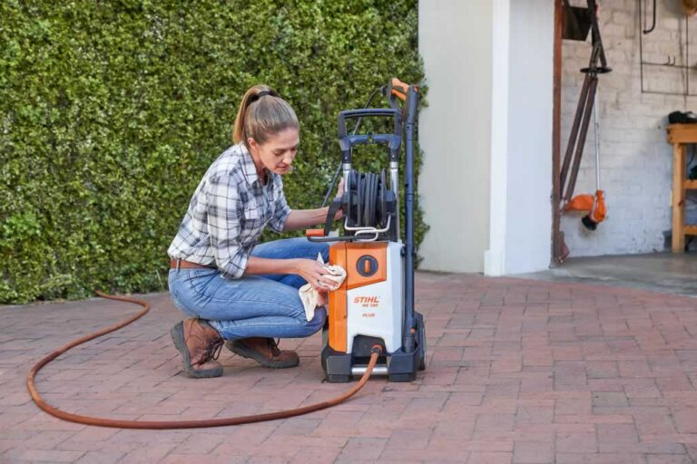 women cleaning pressure washer