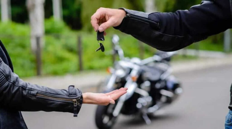 handing the motorcycle keys after a successful trade