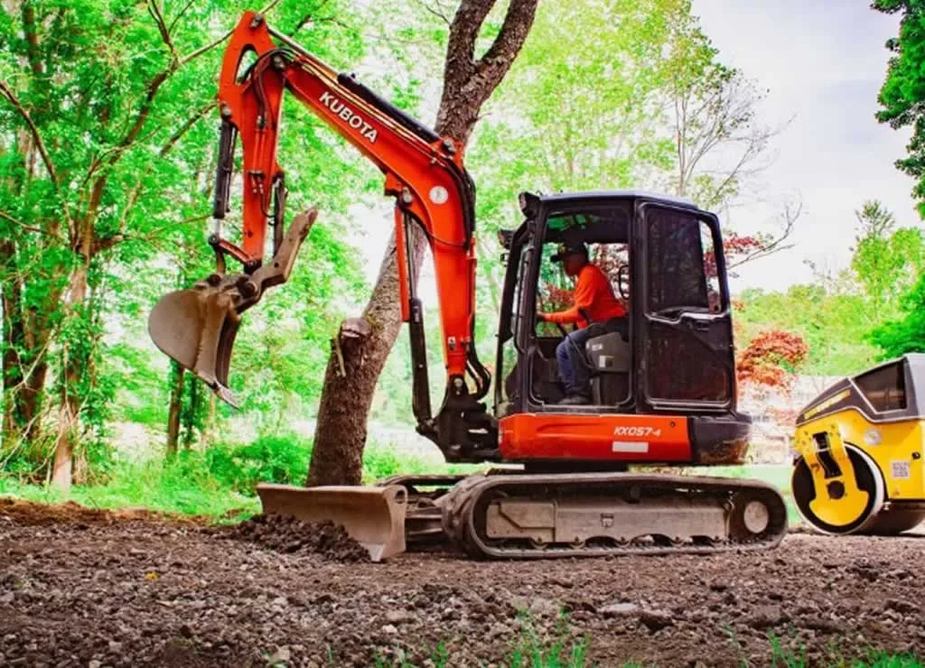 excavator doing gentle excavation in the forest
