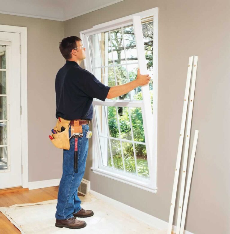 man repairing window in the living room