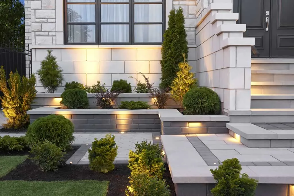 modern retaining wall with LED lights in front of the house