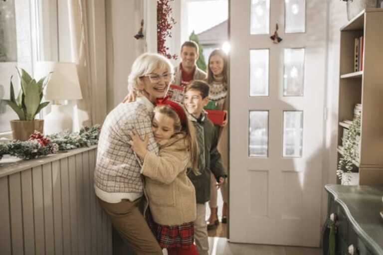 grandma welcoming granddaughter for holidays