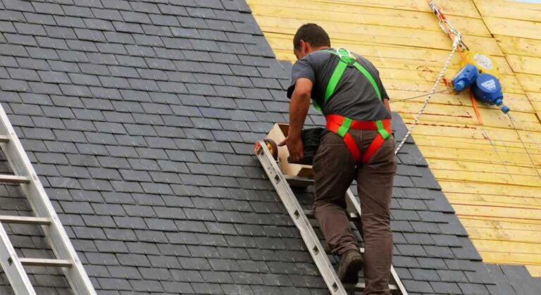 roofer doing slate roofing on the roof