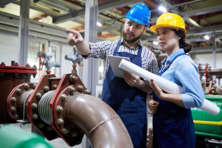 commercial plumber explaining issues to the manager