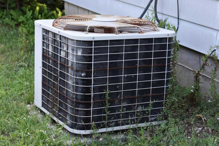 rusty old outdoor air conditioner unit
