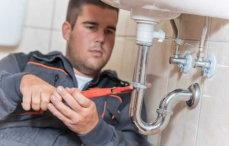 plumber fixing the sink drain