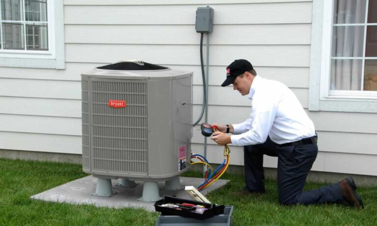 technician repairing HVAC in Illinois home