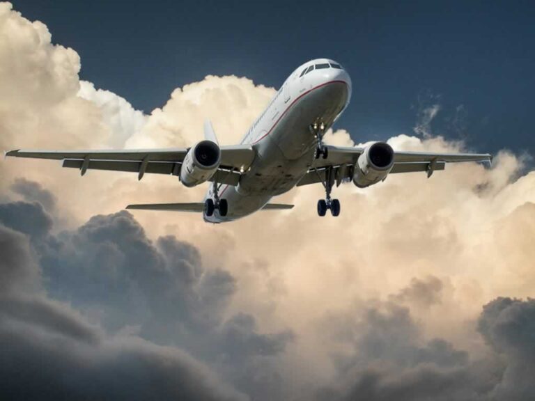 airplane flying into the clouds