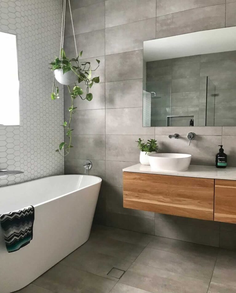 plants and modern mirror added to elevate bathroom