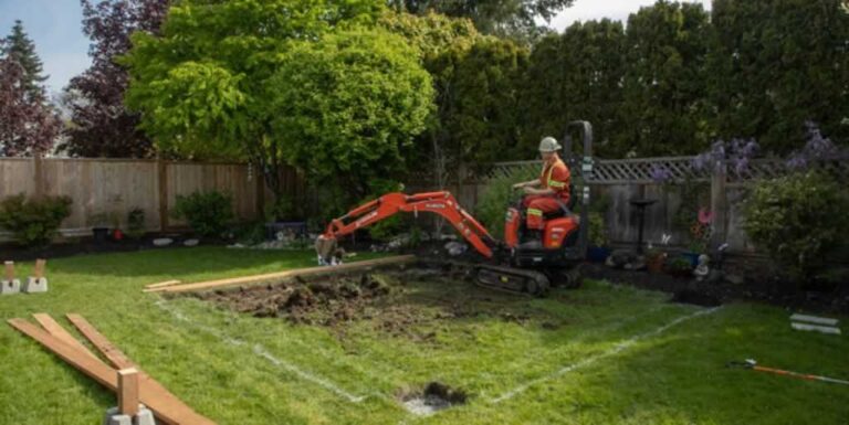excavating ground for patio with an excavator