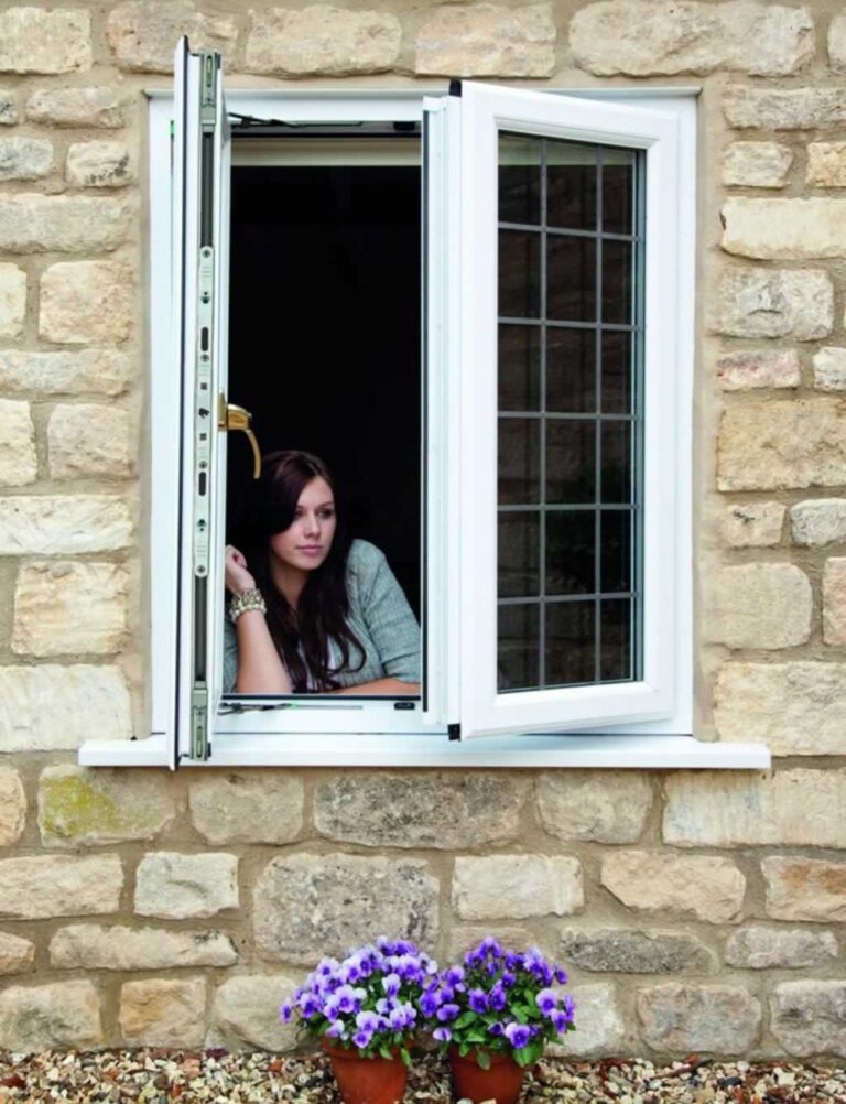 woman opening double glazed windows