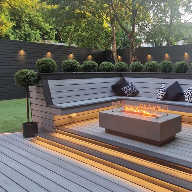 amazing seating area with fire pit in the backyard