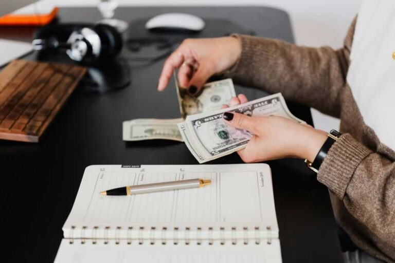 man counting money for bills