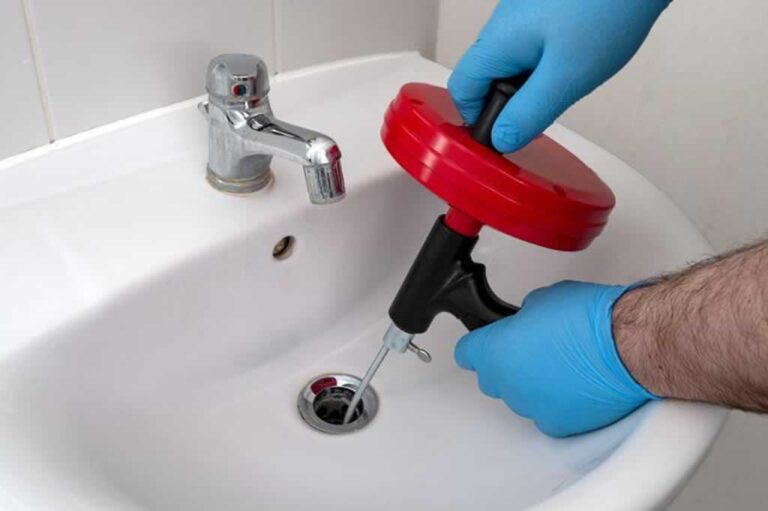 unblocking bathroom sink with snake