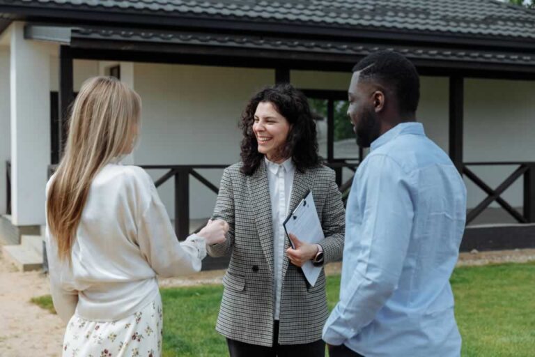 real estate agent with potential buyers
