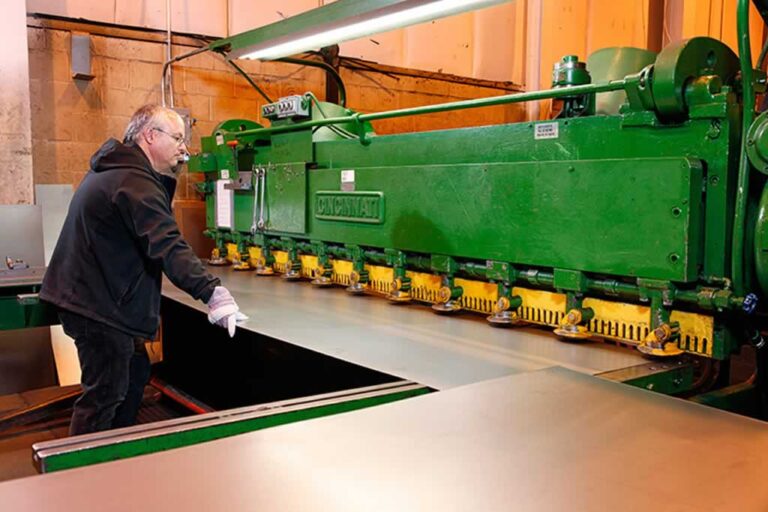 worker doing custom metal fabrication
