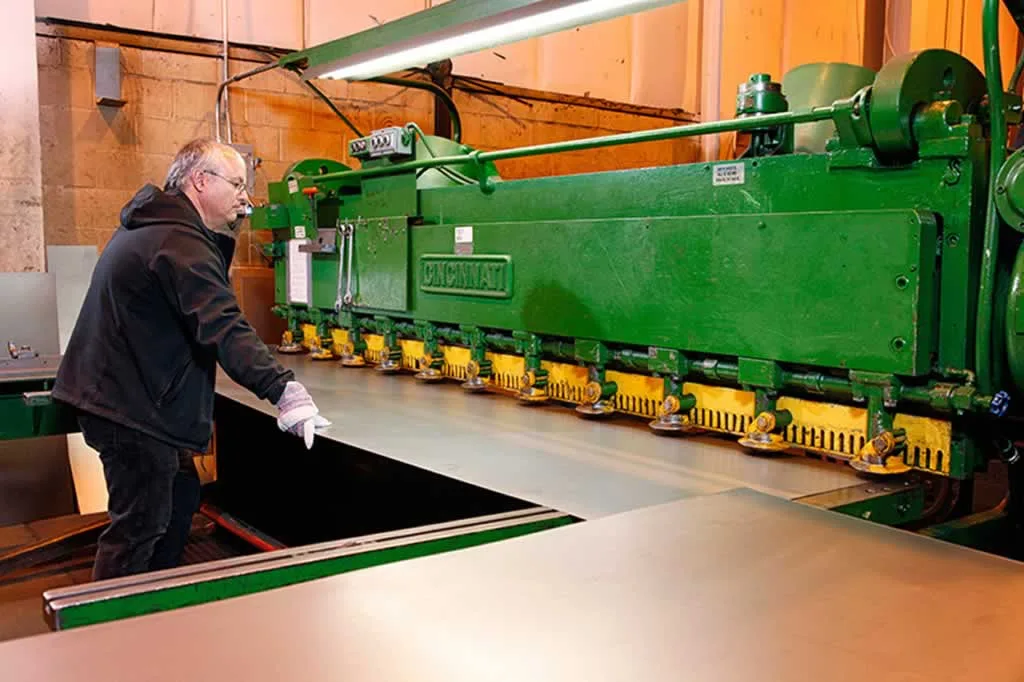 worker doing custom metal fabrication