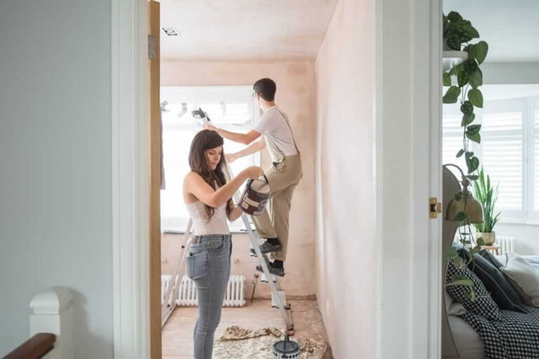 couple choosing paint when renovation