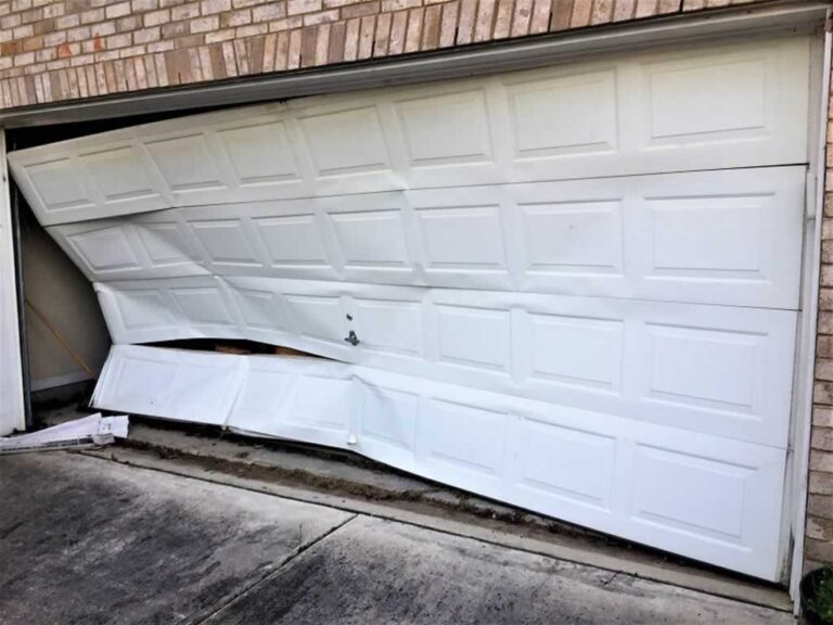 bent garage door because of jammed track