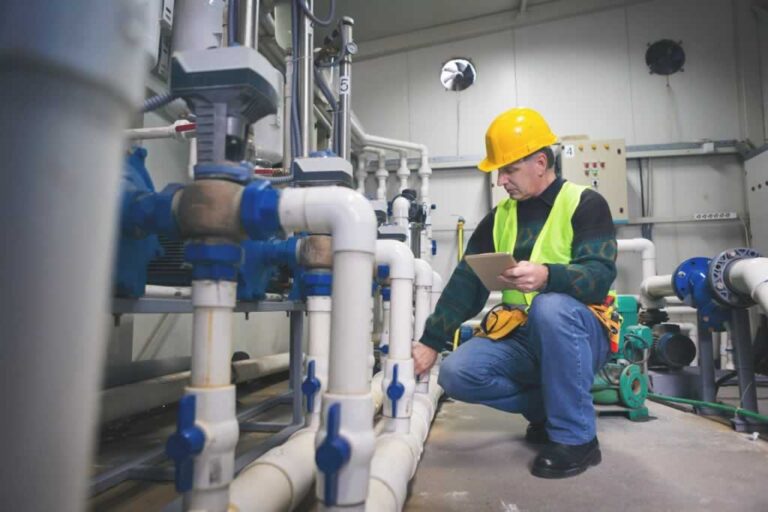 commercial plumber doing plumbing inspection