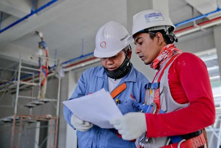 commercial contractors discussing building plans