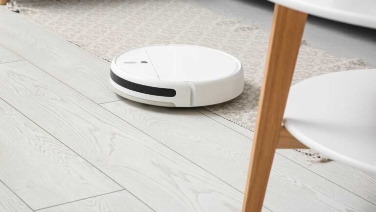 robotic vacuum vacuuming the kitchen