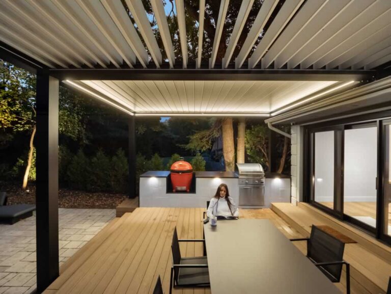 half opened motorized pergola connected to the house