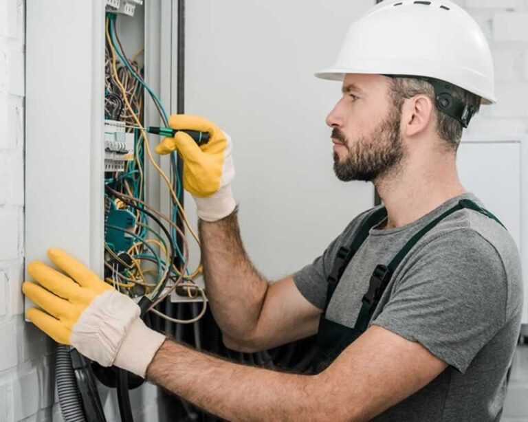 electrician rebuilding an electrical panel