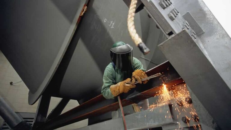 welding steel beam on the building