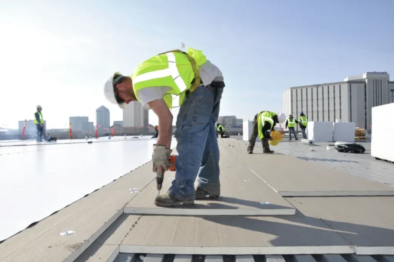 roofers installing new modern commercial roofing solution