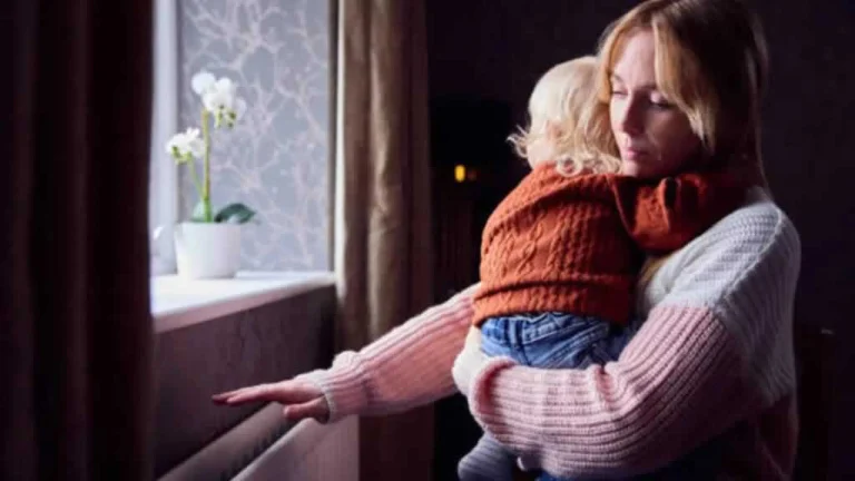 women holding a child checking on heating