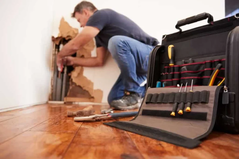 emergency water damage service repairing pipe in the wall