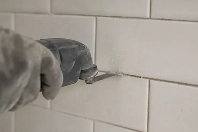 removing old grout with multi tool