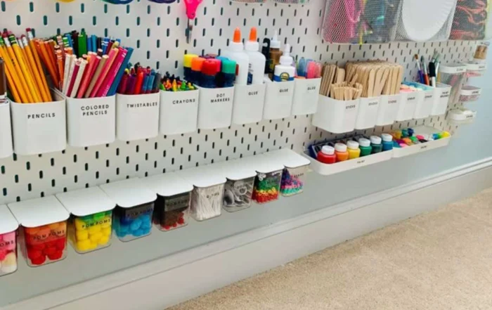 very organized craft room with wall shelves