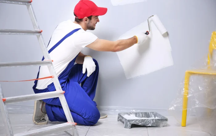 house painter painting with a paint roller