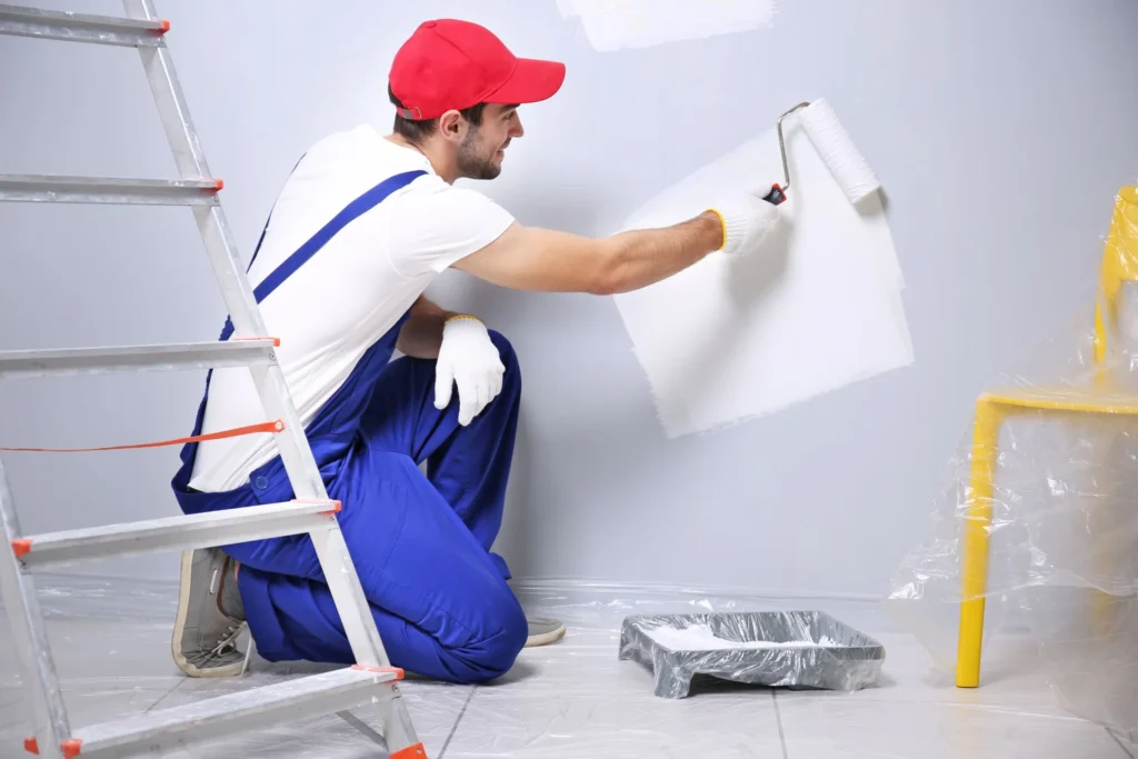 house painter painting with a paint roller
