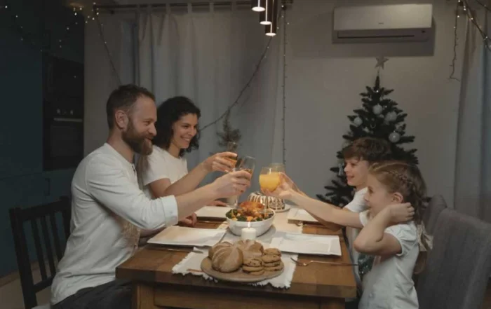 family having dinner in ducted gas heating home