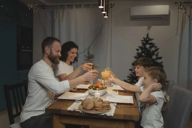 family having dinner in ducted gas heating home