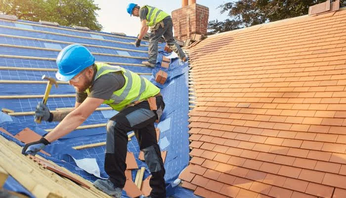 repairing section of the roof affected with damage